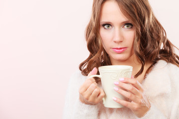 Autumn woman holds mug with coffee warm beverage