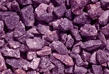 Purple toned gravel pile texture.