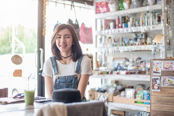 Asian smile girl sitting in coffee cafe