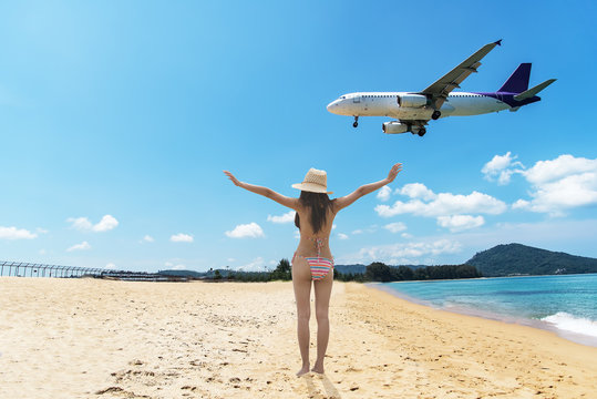 plane landing near the beach