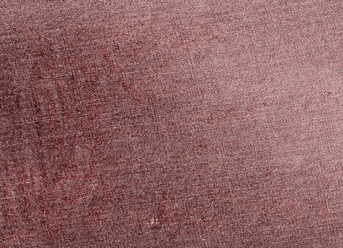 Red color jeans textile texture.