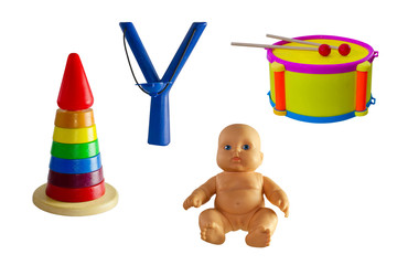 Obraz premium A set of children's toys: a drum, doll, pyramid, slingshot isolated on white background