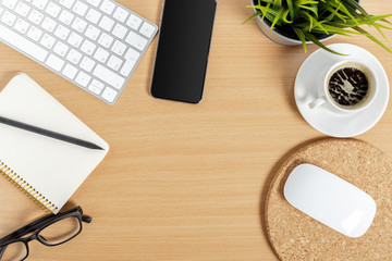 working place at wooden desktop with coffee