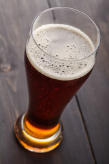 Tall glass of amber ale