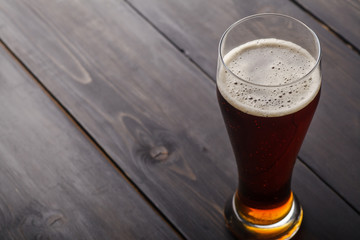 Tall glass of amber ale