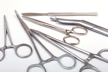 Close Up Surgical instruments and tools on white background. Selective focus.