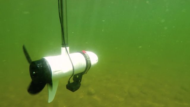 Electric Trolling Motor Operating Underwater In Lake