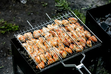 Skewers of chicken or meat fried on a barbecue on the grill, barbecue.