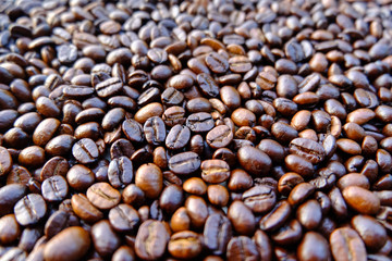 Coffee beans background. roasted coffee beans, can be used as a background. Close up and Macro.