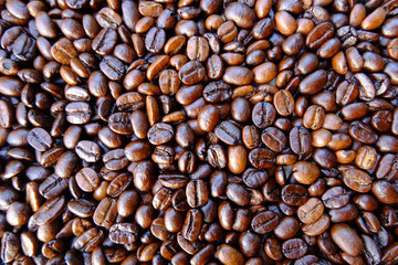 Coffee beans background. roasted coffee beans, can be used as a background. Close up and Macro.