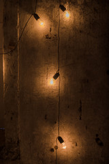 Electric light bulbs on grunge background