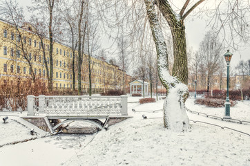 A bridge and a gazebo in the Polish Garden in winter.