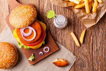 Delicious fish burgerserved with fresh french fries.