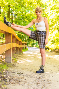 Hiker young woman in nature preparing to hike