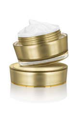 Luxury cosmetic face moisturizing smudged white cream for aged skin in open glossy golden can...
