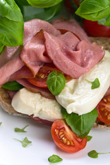 Ciabatta with ham , mozzarella, tomato and basil