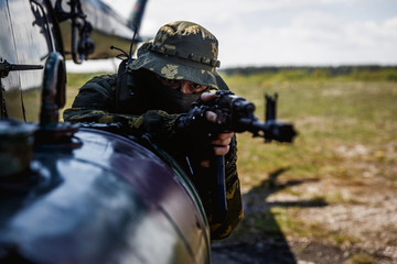 Photo of a soldier with an automatic rifle