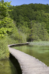 Landscape with wooden track over the water at  "Plitvice Lakes" National Park, Croatia