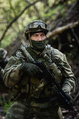 Fototapeta premium Photo of soldier in camouflage