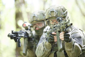 Fototapeta premium Photo of soldiers with submachine-gun
