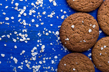 Oatmeal cookies on blue backround. Top view.  Copy space.