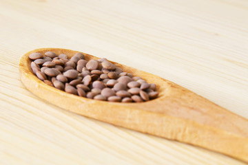 Wooden spoon with lentils