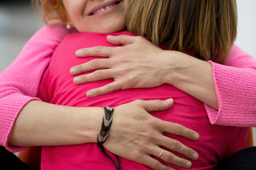Two women are hugging - 156525429