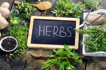 Herbs on a rustic wooden background