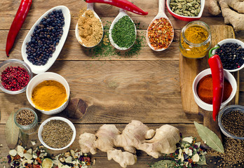 Colorful spices on wooden board. Top view
