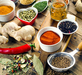 Colorful spices on  rustic wooden background