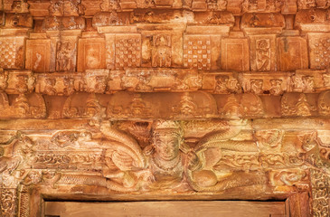 Patterns and figurs of myth creations inside the 7th century Durga temple, medieval era Hindu temple in Aihole, India. Ancient Indian artwork.