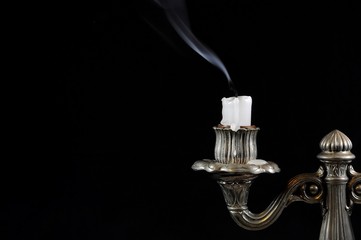 Old silver candlestick with unlit candle