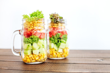 Glass jars with vegetable salad. Healthy food, Diet, Detox, Clean Eating or Vegetarian concept