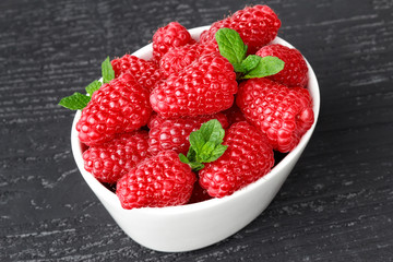 Raspberries in white bowl
