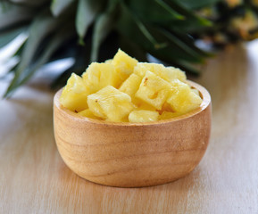pineapple sliced on wood background