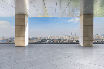 Empty floor with modern city skyline