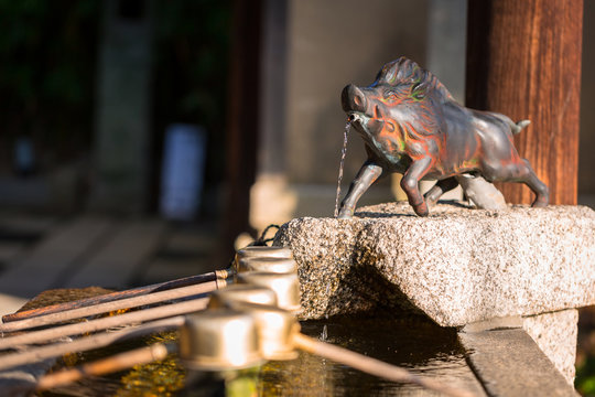 Statue of wild boar guardian at japanese temple in Kyoto