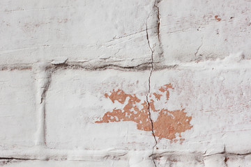 Fototapeta premium Wall of a brick stove in a whitewash