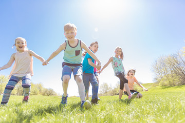 Fototapeta premium Group of child have fun on a field