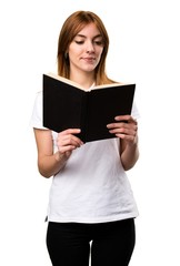 Beautiful young girl reading book