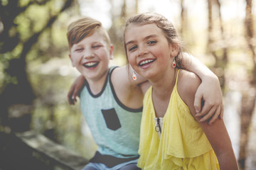 Portrait of a little girl on a yellow background. with his friend