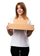 Happy Beautiful young girl holding boxes