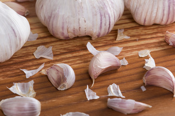 Garlics and bulbs on wooden table