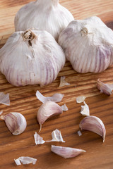 Garlics and bulbs on wooden table