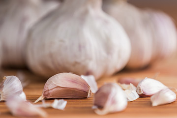 Garlics and bulbs on wooden table