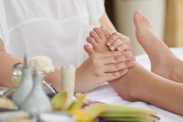 Obraz na płótnie Canvas Foot Massage after Long Working Day