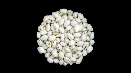 Pistachios on a black background.