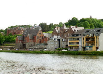 Fototapeta na wymiar Gorgeous vintage architecture along the Meuse river at Dinant, Wallonia Region, Belgium 