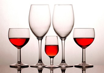 Glasses with red wine isolated on white background