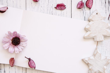 Stock Photography flat lay vintage white painted wood table white note book craft flower petals